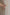 模特兒穿著粉杏桃蕾絲挖背洋裝，日本酮氨纖維涼感面料搭配夏季印花與側邊蕾絲，後挖背與後開叉剪裁展現優雅又具個性的夏日造型。
